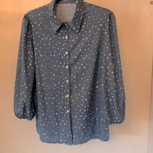 Blue blouse . White buttons . Tiny puff sleeve at shoulder. Elastic cuff . Sz M